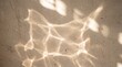 © ryker - Soft abstract sunlight pattern on textured wall creating warm organic reflections and gentle shadow play, evoking calm and minimal interior atmosphere