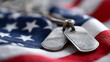 © Kateryna Arkhypova - US military soldier's dog tags worn and rough on an American flag shape, Memorial Day and Veterans Day tribute concept, with copy space