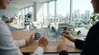 © Haruto - Business people analyzing renewable energy grid stability on futuristic holographic tablet interface, smart city model background discussing sustainable power distribution and