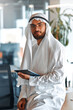 © Valerii Apetroaiei - Arab male businessman in office