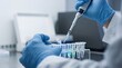© James - Close up of researcher hands using pipette to transfer liquid into test tubes, genetic engineering or DNA analysis process in sterile biotechnology laboratory environment for