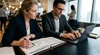 © utaem2022 - Business professionals analyzing financial data during collaborative office meeting