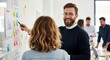 © twilight mist - Professional colleagues collaborate on a project strategy using sticky notes on a whiteboard in a modern office.