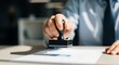 © An Inventive Design - A person stamping a document with a rubber stamp