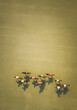 © Nouric - Aerial view of a group of horses and jockeys racing across a grassy field, casting long shadows.