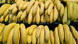 © Mariia - Ripe bananas stacked in a pile. Yellow bananas sold in a supermarket. Food. Bunch of ripe bananas at a street market. Close-up of fresh tropical fruits. Concept of healthy eating and organic products