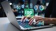 © TheseusStock - Person using ERP system for business management on a futuristic dashboard