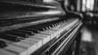 © yuno - Close up of a grand piano keyboard in black and white