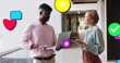 © vectorfusionart - Holding laptop, man explaining, woman wearing shirts holding tablet in office hall floating icons