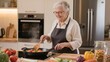 © zuchero - Senior woman cooking healthy meal in modern kitchen