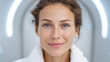 © Ruzana - Close-up of smiling caucasian young adult female in white robe with natural makeup