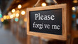 © Ruzana - Chalkboard sign with 'please forgive me' in warm bokeh setting
