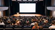© Viktoryia - Massive blank projection screen mockup on stage with podium in large auditorium full of people. Perfect for global summit keynote speech university lecture and event banner templates