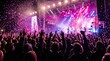 © VisionStock - Vibrant music concert crowd with confetti, energetic live performance under pink stage lights, cheering fans at outdoor festival event