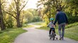© Usup Suhaemi - Father guiding young child learning bicycle.