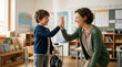 © Nataliia - Young boy high-fiving teacher in classroom with colorful decorations