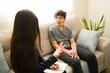 © AntonioDiaz - Teen boy discussing mental health issues with psychologist during a therapy session, receiving counseling and support