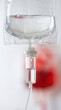 © Breezze - Medical intravenous iv drip bag with saline fluid level and drip chamber in a hospital setting for healthcare advertising, clinical studies and blood donor concepts