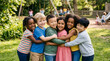 © Carolina Mejía A - Diverse children hugging, smiling in playground