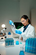 © Parichat - Young scientist performing chemical experiment in laboratory