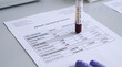 © Karen - Blood Sample Test Tube on Patient Laboratory Report Showing Glycaemic and Lipids Panel Results