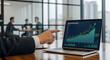 © A. A. MAMUN - Businessman's hand points to a laptop screen displaying a significant ROI performance graph indicating successful financial growth and strategic planning.