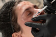 © Pasha - Close up of cosmetologist performing facial cosmetic injection on young woman in beauty clinic. Aesthetic procedure for skin care and wrinkle reduction. Professional cosmetology and skincare concept.