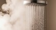 © Tatiana - Chrome shower head spraying hot water in steam. Bathroom equipment for hygiene and relaxation. Concept of spa routine and daily wellness in modern house. Health and clean living lifestyle.