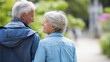 © Nataliya - Rear view of a senior couple walking together in a park making eye contact with each other, retirement togetherness concept, active senior couple, outdoor relationship lifestyle, defocused
