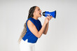 © VISTA by Westend61 - Activist shouting into a blue megaphone against white background