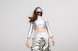 © VISTA by Westend61 - Futuristic cyborg in metallic clothes and VR visor outdoors