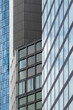 © yaqui_villegas - Modern architecture facade with glass windows shows office corporate finance pattern and symmetry in dramatic perspective of urban highrise details