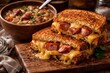 © VRVisionary - Kielbasa sausage and gouda melted in grilled cheese sandwiches served with savory ham and bean soup