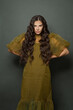© millaf (Nemchinova) - Cute brunette woman with long healthy hair on dark background