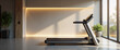 © Vladimir - Empty hotel gym with a treadmill and natural light near windows