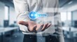 © PixelCraft - Unlock Your Potential Person's Hand Offers a Glowing Digital Key Icon, Symbolizing Access and Opportunity in a Blurred Office Background