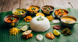 © MstMorjina - Traditional south indian thali meal served with steamed rice and various curries on a fresh green banana leaf