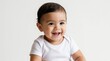 © Maryna - Adorable smiling hispanic baby boy sits in white outfit against pure white background. He has dark hair and big dark eyes. A happy expression fills his face.