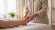 © ViskBx - Professional therapist giving a relaxing foot massage to a client in a bright spa or wellness center reflexology and body care spa