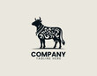 © Dawi Firdaus - Black decorative cow silhouette is displayed in elegant ornamental vector logo style