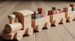 © ManuStockStudio - Wooden toy train carrying gift boxes and presents in a festive holiday scene with warm soft lighting background
