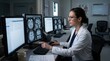 © Jayk - Doctor analyzing brain scans on multiple computer monitors in a medical office