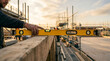 © MYS Design - Construction worker using a yellow spirit level on a wooden beam