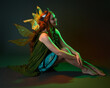 © faestock - portrait of female model wearing fantasy fairy costume, green dress, cloak, butterfly wings and crown. full length sitting pose, kneeling on floor, dark studio background.