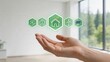 © Elijah - Future eco friendly smart home concept human hand holding green hologram icons representing sustainable energy saving wind solar power technology