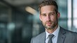 © CHI - leader. Confident businessperson in grey suit against a softly blurred office background. pitch deck slides, case study pages, designed for enterprise HRIS and productivity software interfaces.