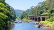 © chusnul - A scenic view of a train traversing a bridge over a tranquil river surrounded by lush greenery
