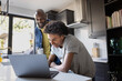 © ReeldealHD images - Father and son enjoying time together on laptop