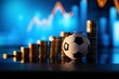 © shahjalal - Soccer ball on stacked coins with rising bar chart illustrating financial growth, investment strategy, business success, profit increase, economic trends, and wealth building concept.