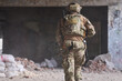 © .shock - Military Soldier in Camouflage Gear Moving Through Abandoned Urban Building During Tactical Operation
